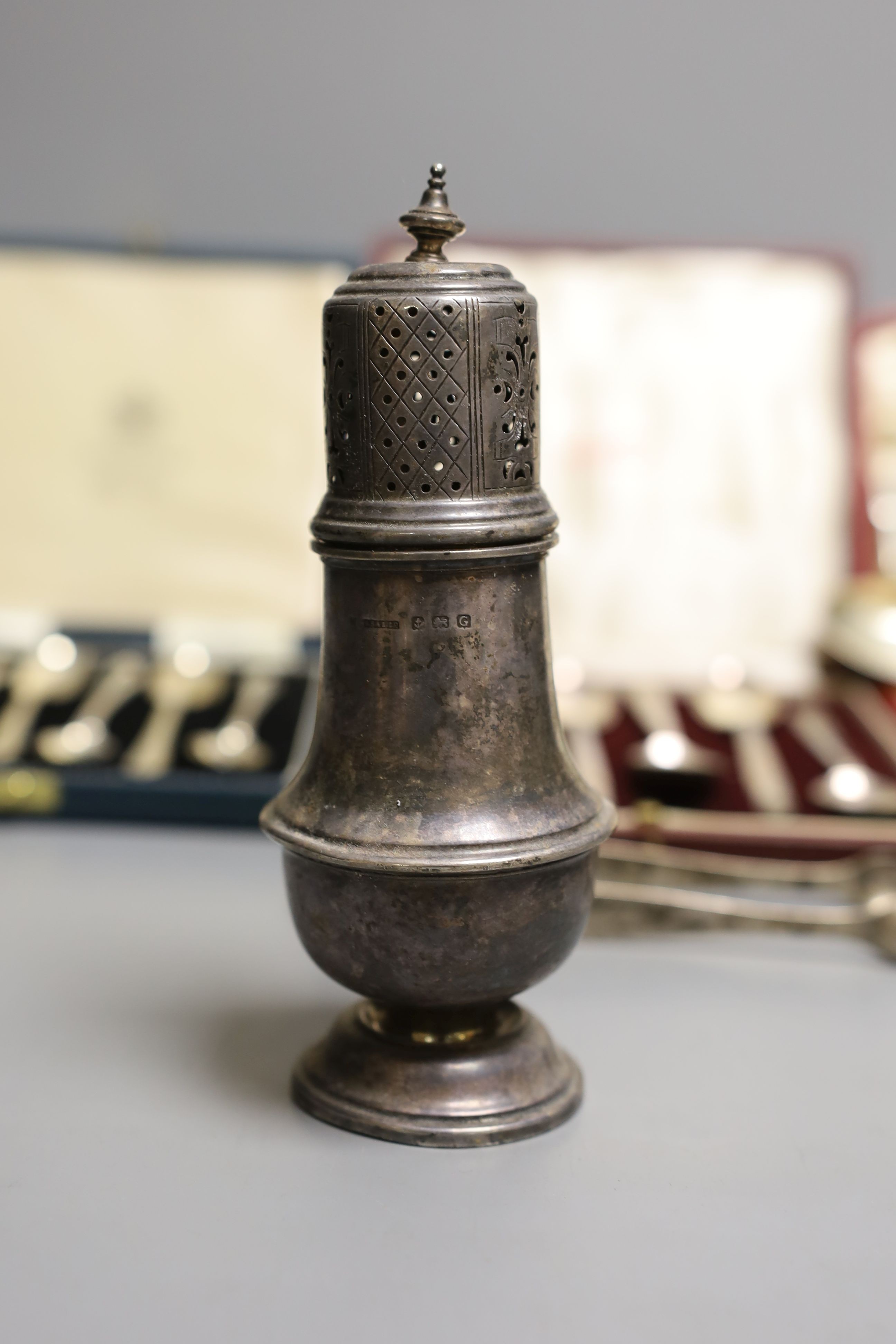 Two cased sets of six silver teaspoons including Art Deco and a cased set of Scandinavian gilt white metal and enamel coffee spoons(a.f.0, a silver sugar caster, pair of silver tongs and a Georgian silver caddy spoon.